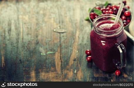 Cranberry smoothie on rustic wooden background - Healthy eating, Detox or Diet concept