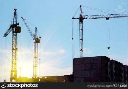 crane and blue sky on building site