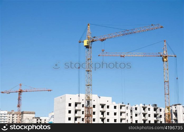 crane and building under construction on the skyline