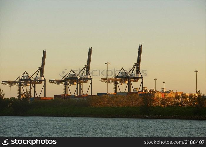 Crane and cargo containers at a commercial dock, Miami, Florida, USA