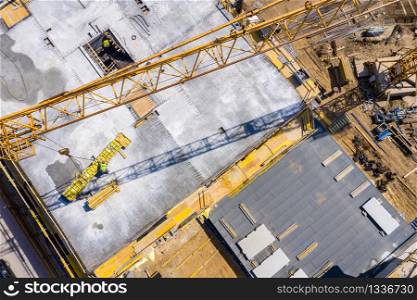 Crane and highrise construction site. aerial View