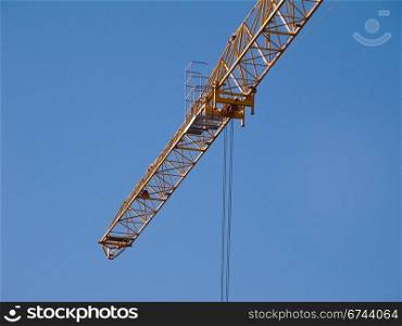 Crane jib detail. Detail of the jib of a yellow hoisting tower crane