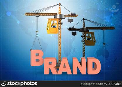 Crane lifting brand letters on commercial concept