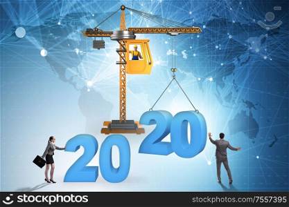 Crane lifting year 2020 in the business concept. Crane lifting year 2020 in business concept