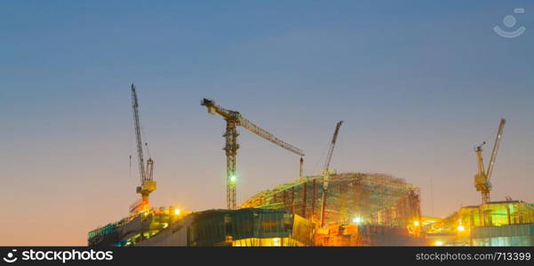 crane on the building, the construction of a high-rise building in the evening