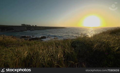 Crane shot of a sunset at Spoonera??s Cove
