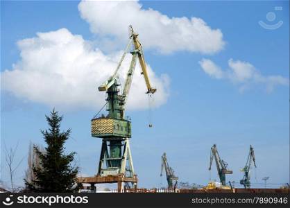Cranes at a freight shipping por, blue sky