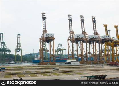 Cranes cargo shipping in Singapore city. Transportation industry international of Singapore city.