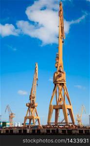 Cranes of the dockyards of Cadiz in a sunny day. Dockyards of Cadiz