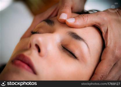 Craniosacral Therapy Massage. CST therapist Massaging of Woman&rsquo;s Head.. CST therapist Massaging Woman&rsquo;s Head. Craniosacral Therapy Massage.