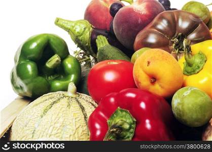 crates of fruit and vegetables on white background in studio.