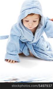 crawling baby boy in blue robe over white