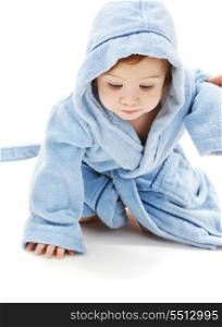 crawling baby boy in blue robe over white