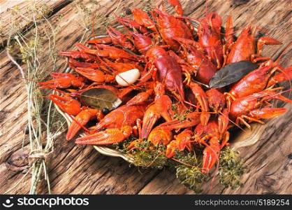 crayfish in a metal dish. Cooked crayfish with spices on a stylish tray