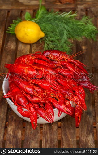 Crayfish. red boiled Crayfish in bowl on wooden table with dill and lemon