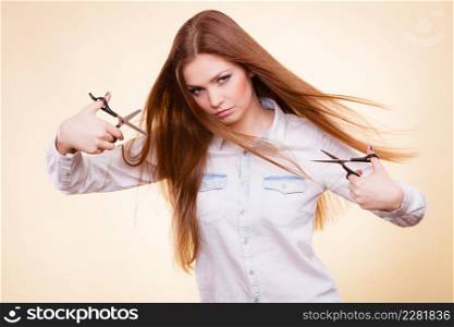 Craziness of professional hairdresser. Hair hygiene. Girl with scissors making crazy funny face preparing herself to cutting styling new image hairdo coiffure.. Crazy girl with scissors. Hairdresser in action.