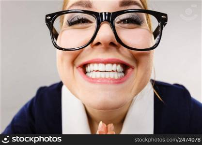 Crazy bizarre business woman or teacher wearing nerd eyeglasses. Female being energetic motivated, wide angle view.. Close up of happy crazy business woman