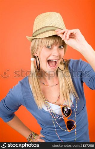 Crazy blond girl wear hat shouting on orange background
