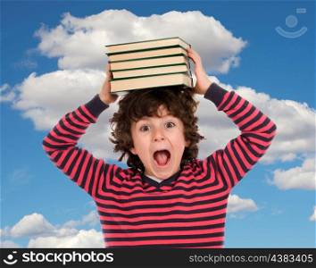 Crazy child shouting with books on the head