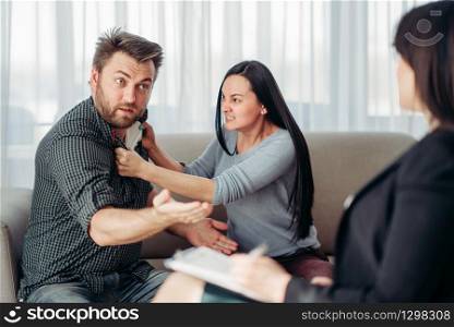 Crazy couple, patients at psychotherapist reception, civilized solution to the problem. Female doctor helps with consultation, family psychology support. Crazy couple patients at psychotherapist reception