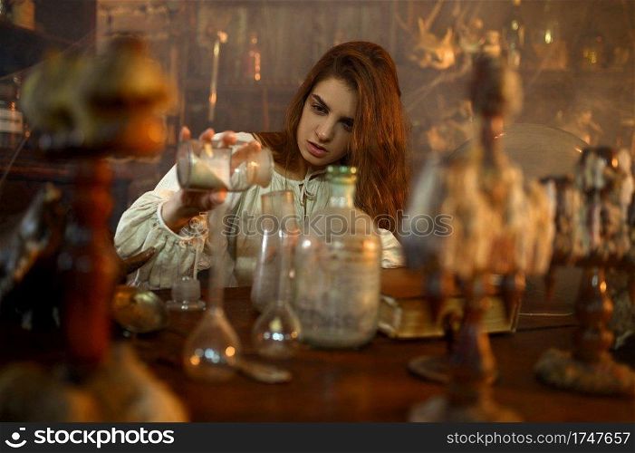Crazy demonic woman mixes potions, demons casting out. Exorcism, mystery paranormal ritual, dark religion, night horror. Demonic woman mixes potions, demons casting out