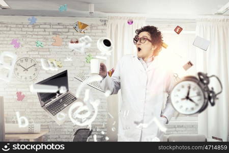 Crazy funny doctor. Young mad doctor in white uniform screaming