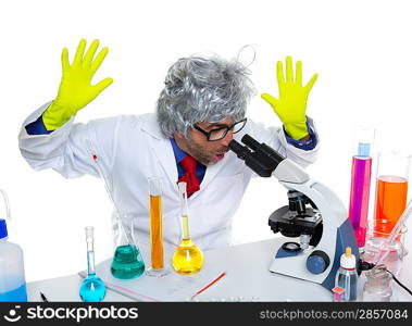 Crazy mad nerd scientist at laboratory microscope surprised expression