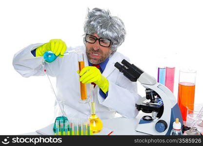 Crazy mad nerd scientist funny expression at laboratory on chemical experiment