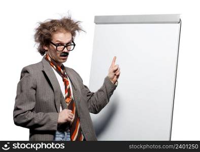 Crazy professor / scientist / lecturer with mad hairstyle wearing horn rimmed glasses and fake mustache standing in front of a whiteboard and pointing it