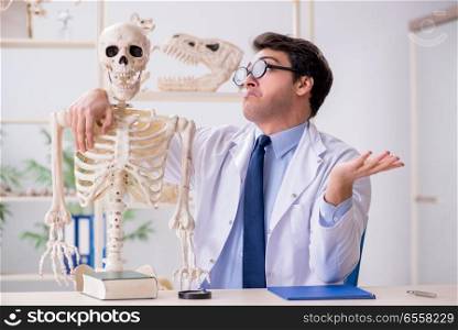 Crazy professor studying human skeleton