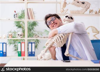 Crazy professor studying human skeleton