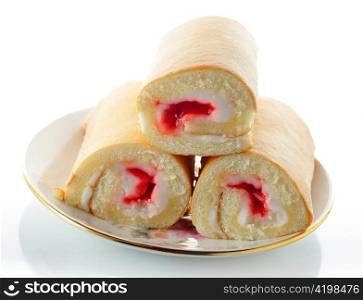 Cream and Strawberry rolls on a plate