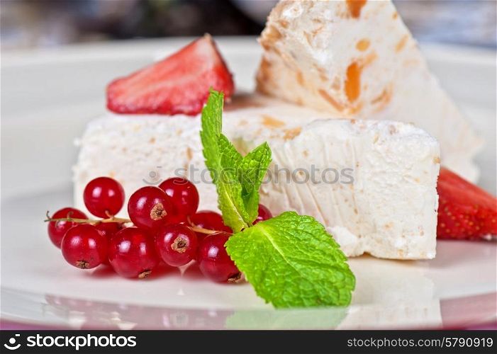 cream berries dessert. cream dessert with berries cranberries and strawberry