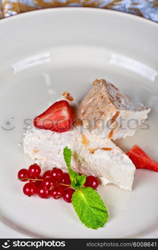 cream berries dessert. cream dessert with berries cranberries and strawberry