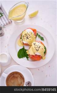 Cream cheese, Smoked salmon and poached egg toasts on a plate.. Eggs Benedict with Cream cheese and Smoked salmon on a plate