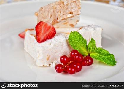 cream dessert with berries cranberries and strawberry