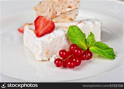cream dessert with berries cranberries and strawberry