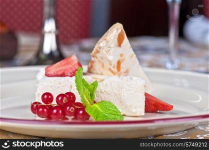 cream dessert with berries cranberries and strawberry. cream berries dessert