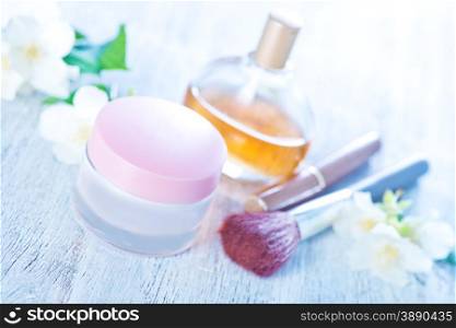 cream for body in bank and on a table
