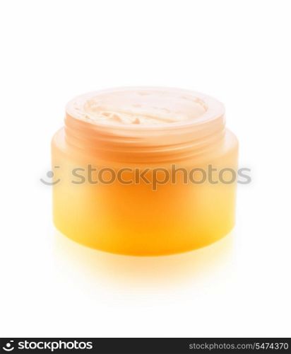 Cream for skin care in a saturated jar isolated on a white background