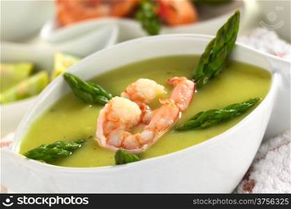 Cream of asparagus with shrimps (Selective Focus, Focus on the lower edge of the shrimp). Cream of Asparagus with Shrimp