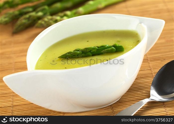 Cream of green asparagus (Selective Focus, Focus on the asparagus head on the soup). Cream of Asparagus