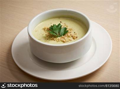 cream soup in white bowl closeup