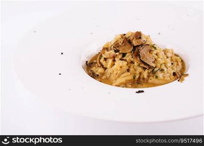 Creamy cheese risotto with slices of truffle