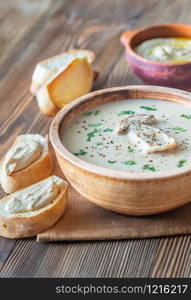 Creamy mushroom soup with toasted baguette and hummus