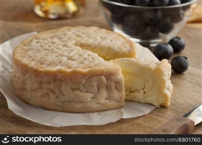 Creamy ripe Epoisses cheese close up