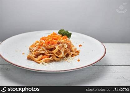 creamy sauce pasta with ebiko , selective focus . creamy sauce pasta with ebiko 