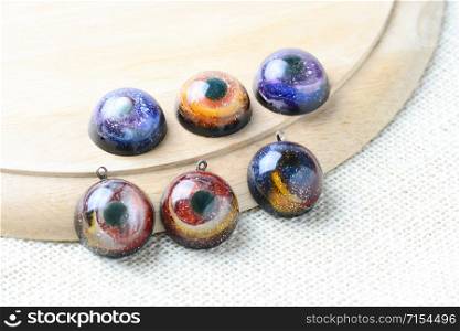 Create galaxy drink coasters using resin, glitter and pigment powders, handmade items. Suitable for keychains, necklace and pendant.