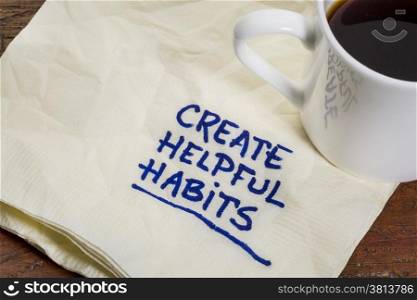 create helpful habits reminder or advice - handwriting on a napkin with cup of espresso coffee