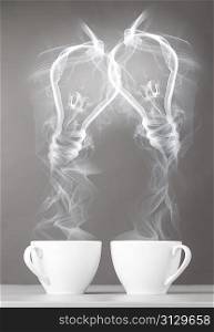 creating idea. bulbs silhouette from steaming hot coffee cup